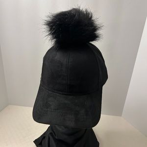 new caps, black suede with fur ball on top